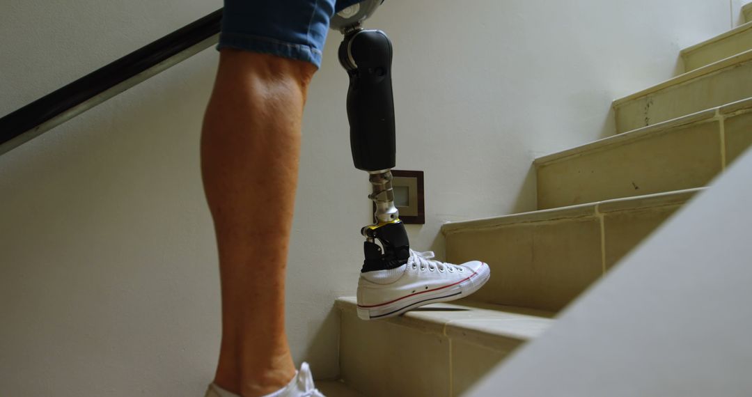 Person with Prosthetic Leg Climbing Stairs Showing Determination - Free Images, Stock Photos and Pictures on Pikwizard.com