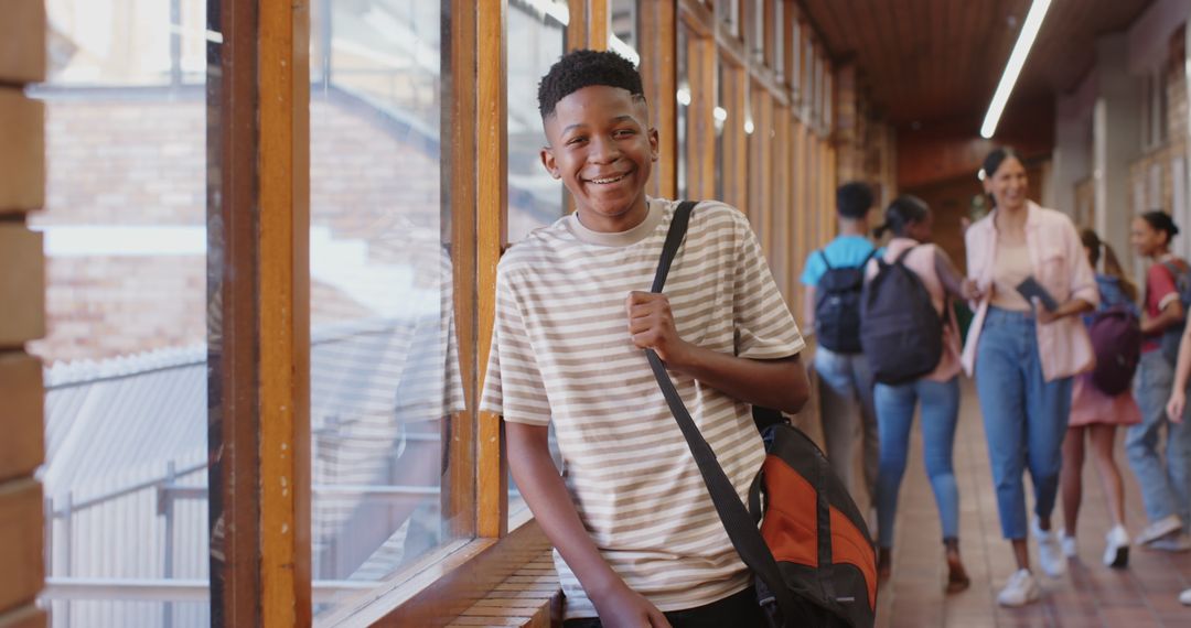 Smiling Teen Boy at School Hallway with Backpack Ready for Class