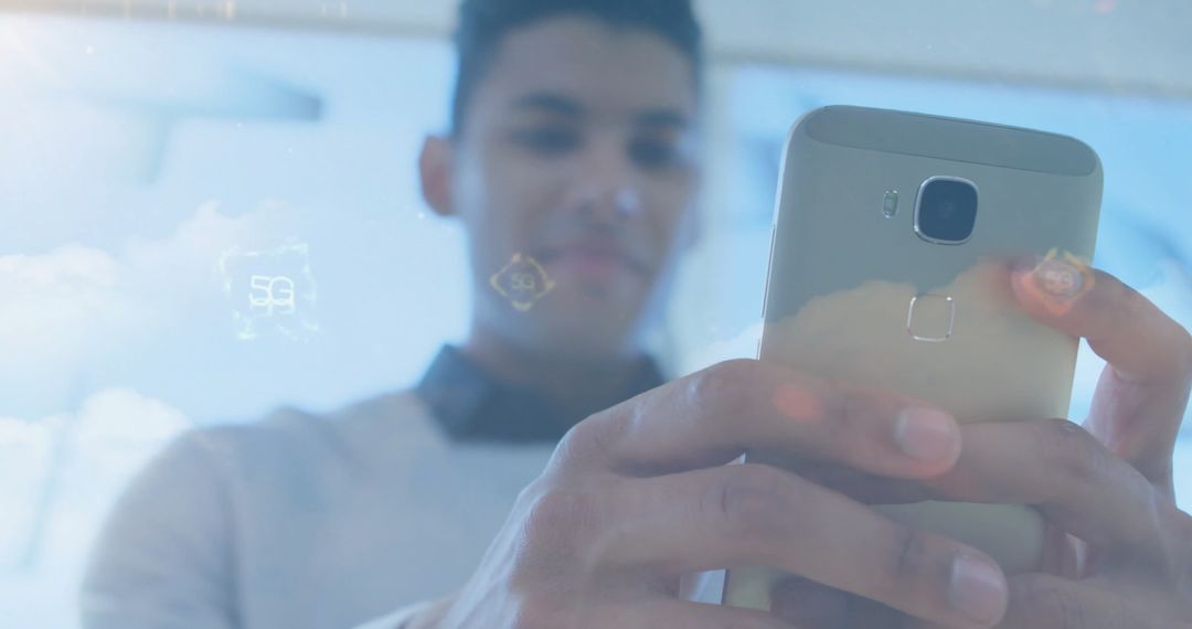 Young Professional Engaging with Smartphone and Digital Holograms