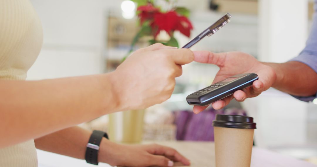 Image of hands of biracial woman paying with smartwatch for coffee - Free Images, Stock Photos and Pictures on Pikwizard.com