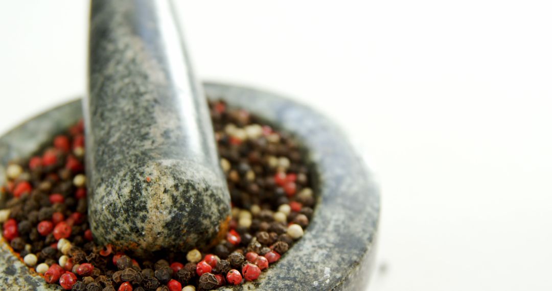 Granite Mortar and Pestle Filled with Black and Red Peppercorns - Free Images, Stock Photos and Pictures on Pikwizard.com