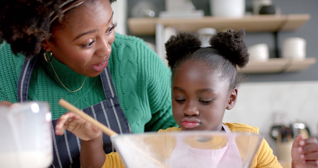 African American Mother and Daughter Baking Together in Kitchen - Free Images, Stock Photos and Pictures on Pikwizard.com