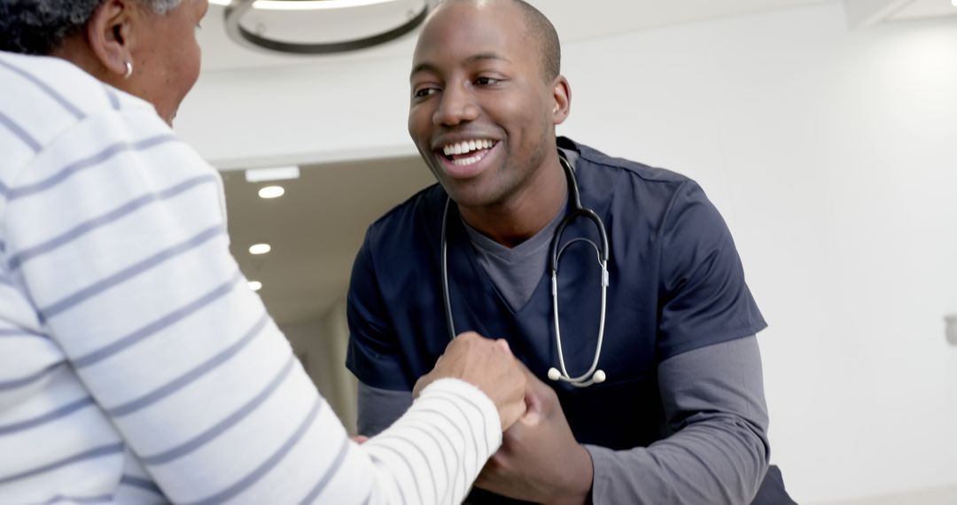 Friendly African American Nurse Assisting Elderly Patient in Hospital - Free Images, Stock Photos and Pictures on Pikwizard.com