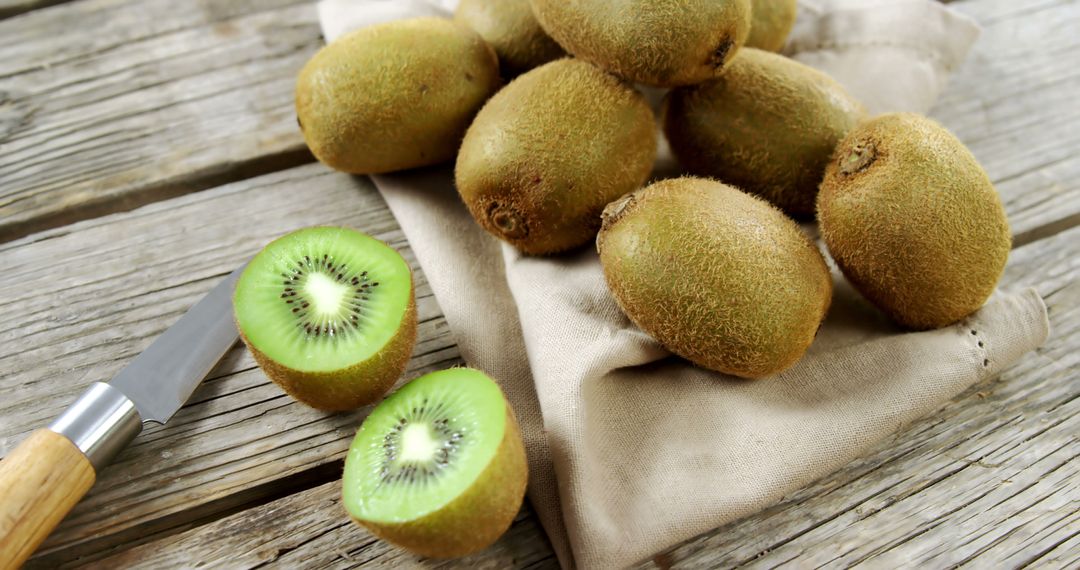 Fresh Kiwi Arrangement on Rustic Wooden Tabletop - Free Images, Stock Photos and Pictures on Pikwizard.com