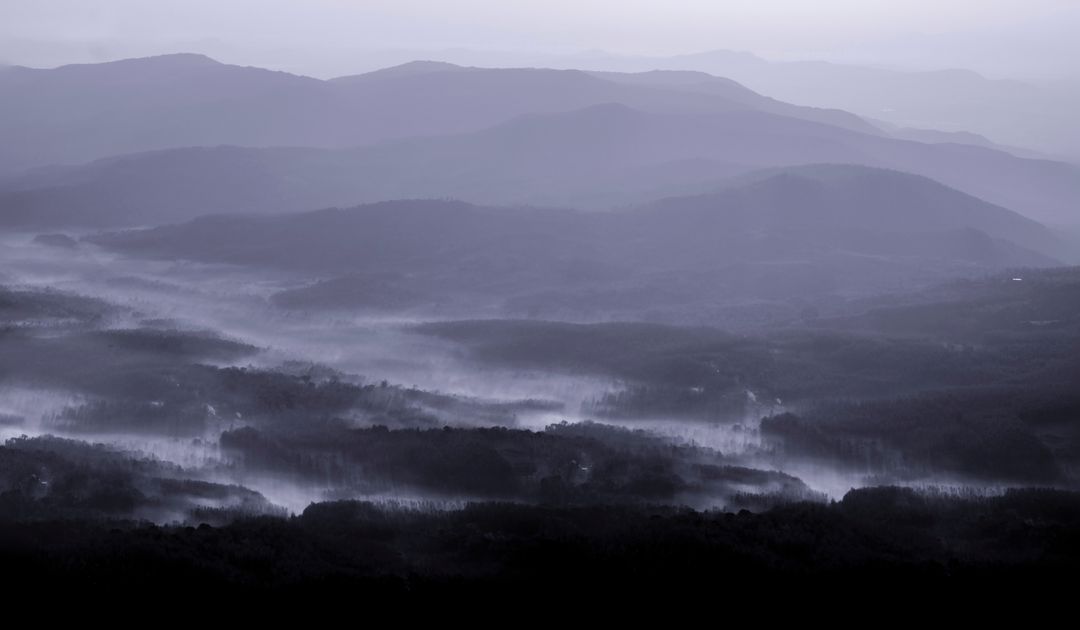 Misty Mountains with Rolling Landscape at Dawn - Free Images, Stock Photos and Pictures on Pikwizard.com