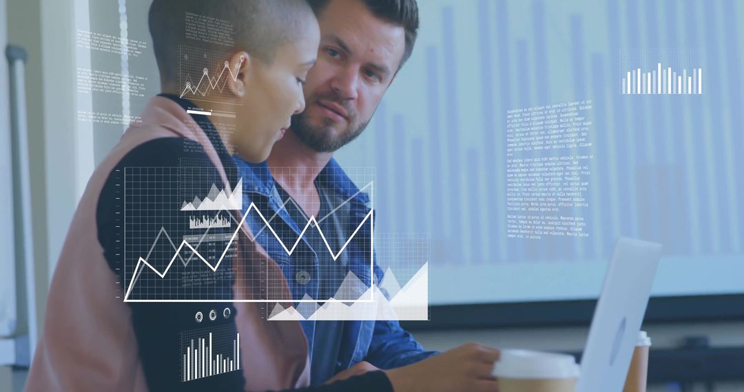 Colleagues collaborating over laptop displaying data visualization overlays and analytics