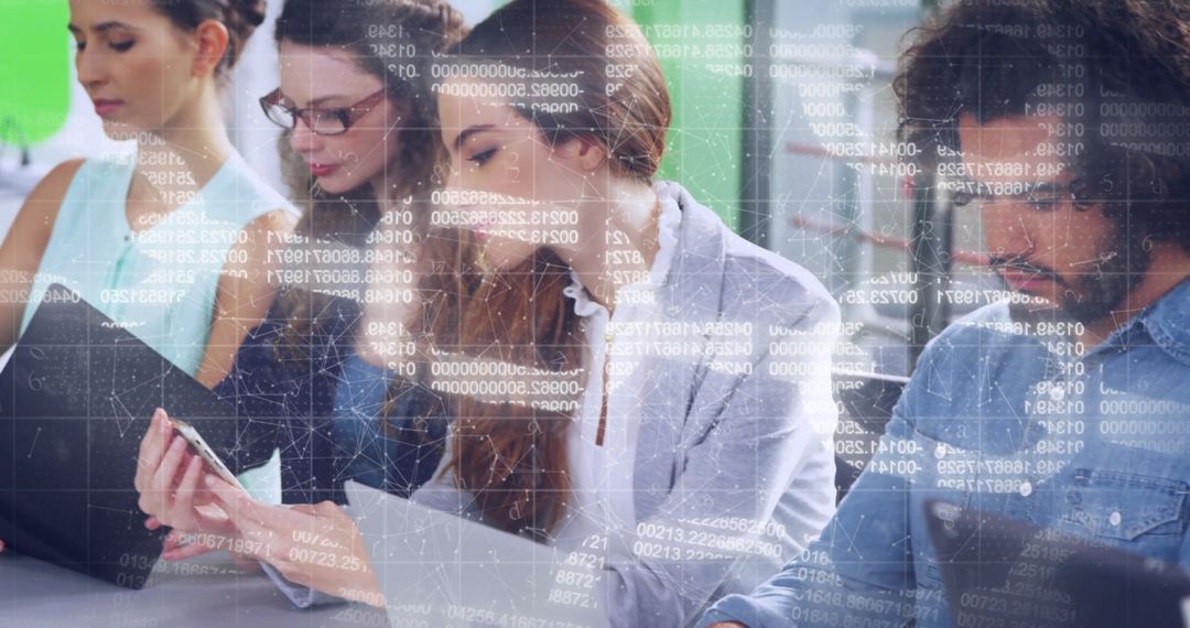 Young Professionals Engaged in Collaborative Data Analysis