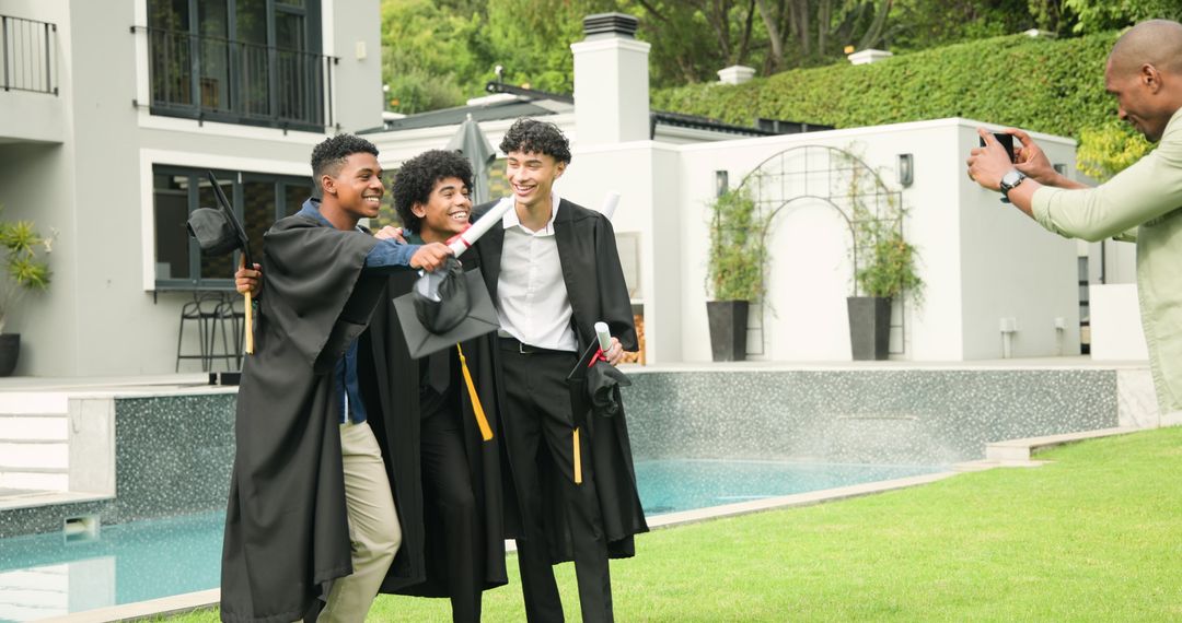 Diverse Graduates Celebrating Achievement Together by Poolside