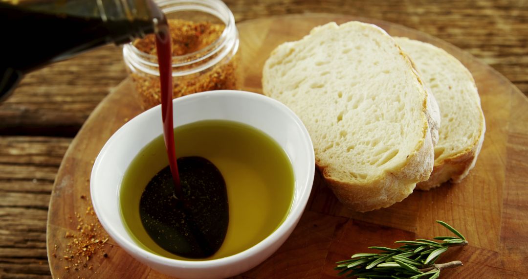 Olive Oil and Balsamic Vinegar with Fresh Bread on Wooden Board - Free Images, Stock Photos and Pictures on Pikwizard.com