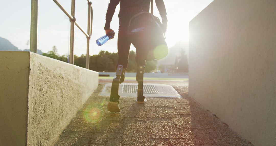 Determined Athlete with Prosthetic Legs Heading Out for Morning Run - Free Images, Stock Photos and Pictures on Pikwizard.com