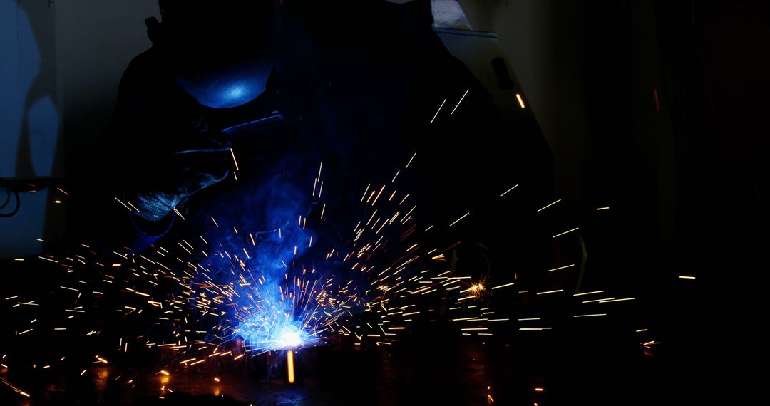 Welder Wearing Protective Gear Welding Metal with Sparks - Free Images, Stock Photos and Pictures on Pikwizard.com