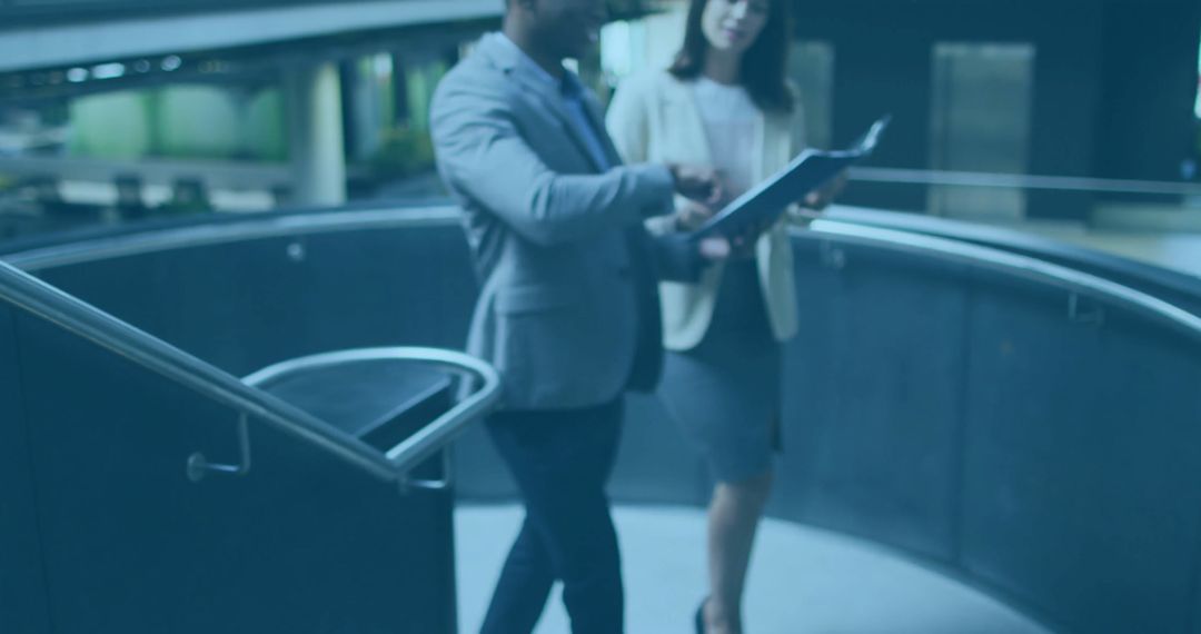 Professional Collaboration in Corporate Office Lobby with Modern Architecture