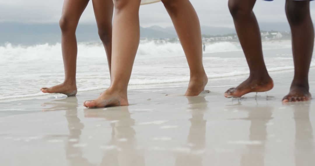 Barefoot Family Walking on Sea Shore Together - Free Images, Stock Photos and Pictures on Pikwizard.com