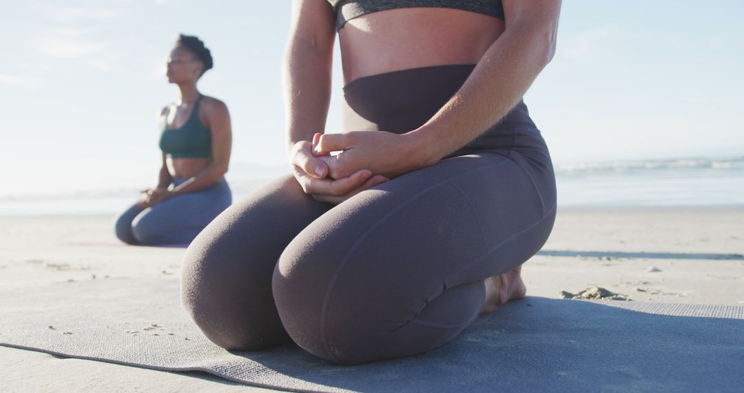 Group of diverse female friends meditating at the beach - Free Images, Stock Photos and Pictures on Pikwizard.com