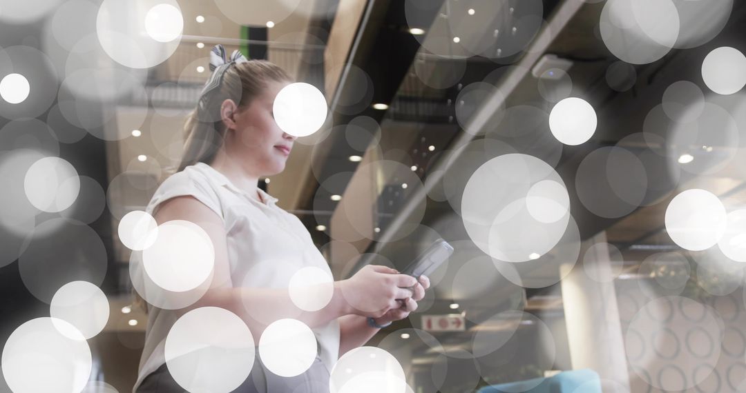 Commuter Holding Smartphone in Modern Transit Lounge