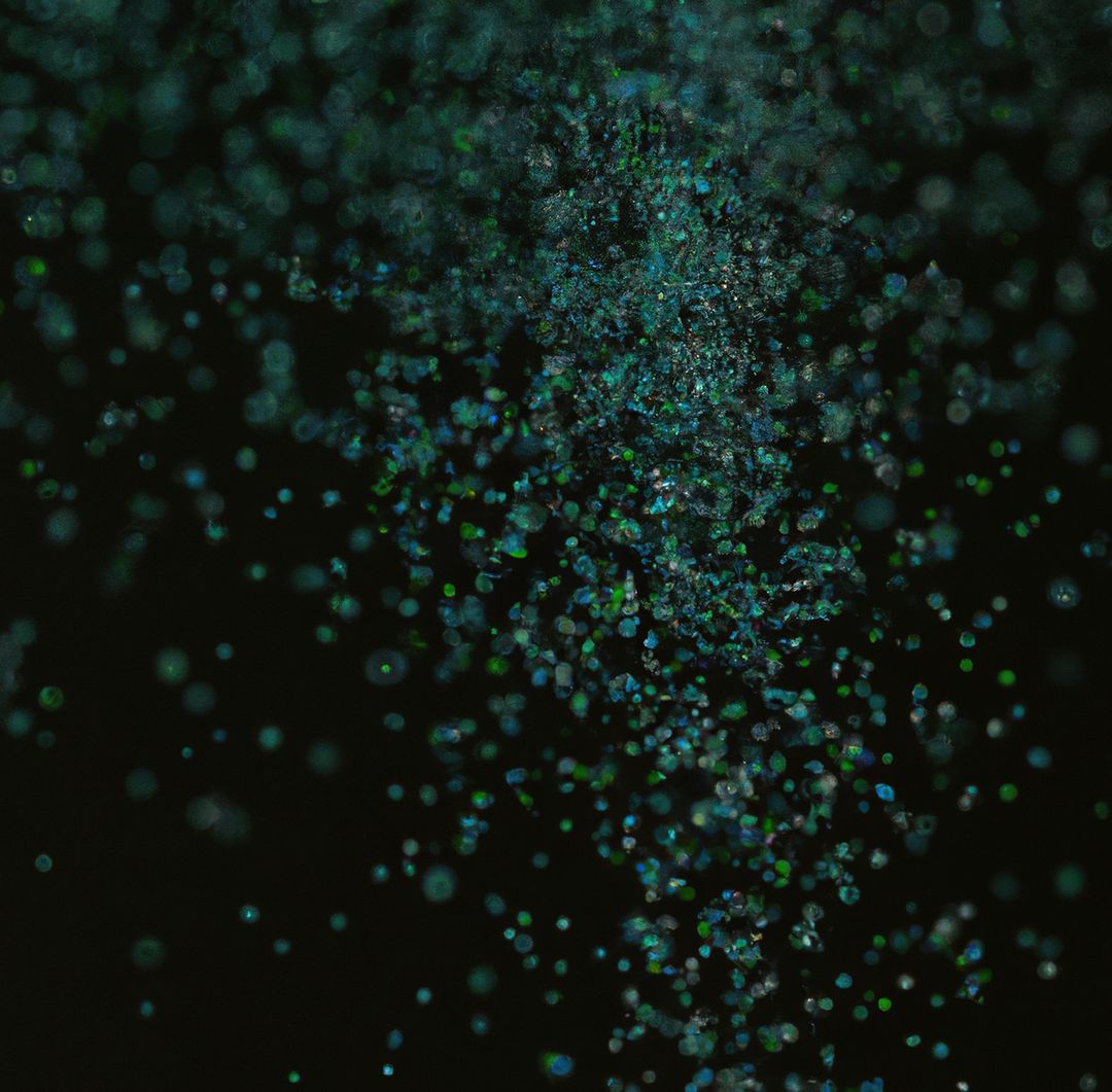 Image of close up of multiple green particles on dark background - Free Images, Stock Photos and Pictures on Pikwizard.com