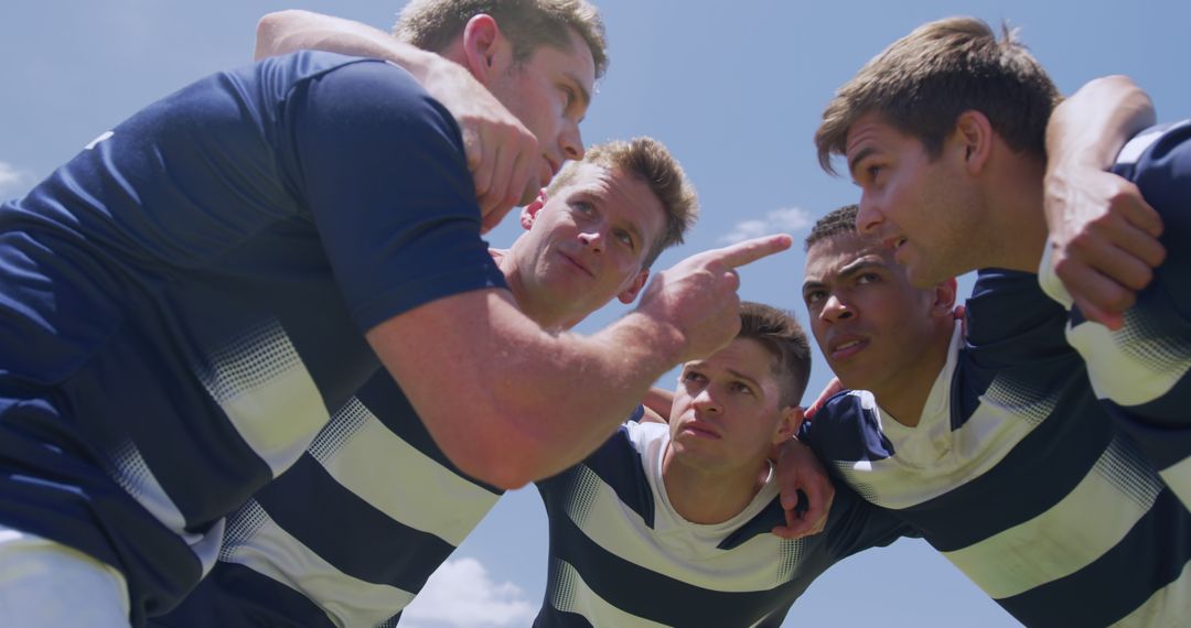 Rugby Players Sharing Strategy in Team Huddle Outdoors - Free Images, Stock Photos and Pictures on Pikwizard.com