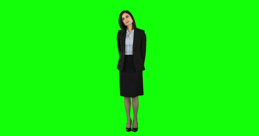 Businesswoman Standing on Green Screen Background in Formal Attire - Free Images, Stock Photos and Pictures on Pikwizard.com