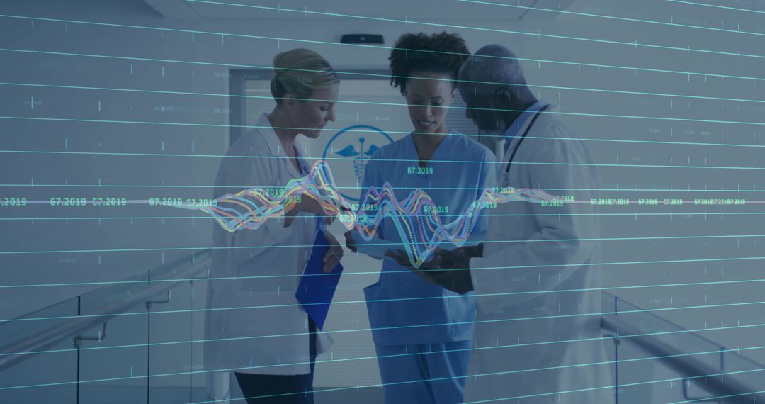 Medical Team Analyzing Data in Hospital Corridor with Technology Integration