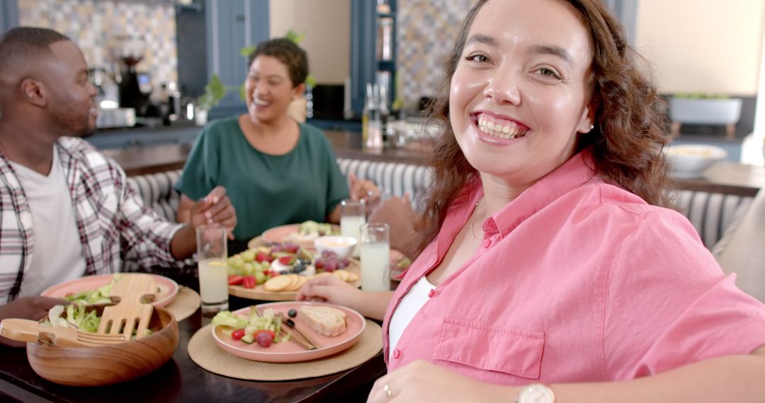 Diverse Friends Enjoying Meal Together, Creating Joyful Memories