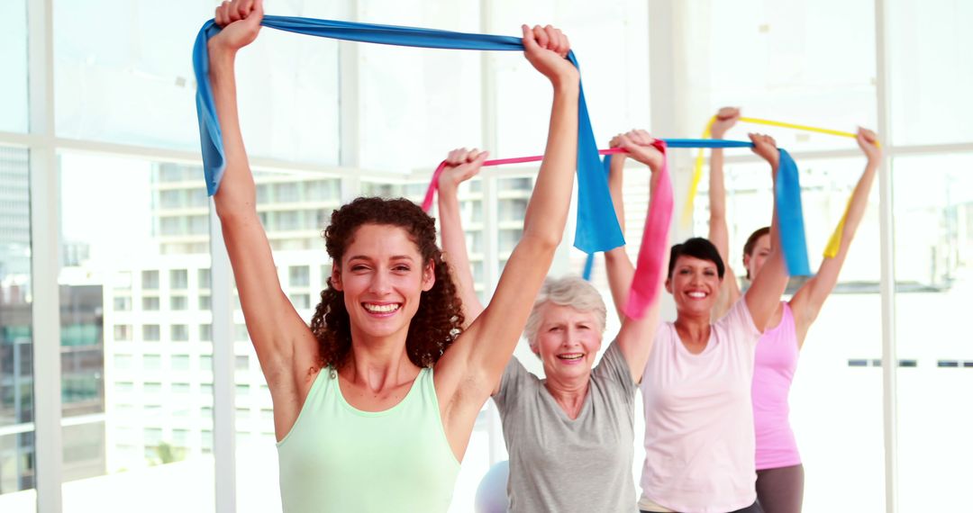 Diverse Women Exercising with Resistance Bands in Fitness Class - Free Images, Stock Photos and Pictures on Pikwizard.com