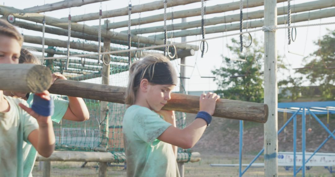 Children Carrying Logs During Outdoor Team Building Activity - Free Images, Stock Photos and Pictures on Pikwizard.com