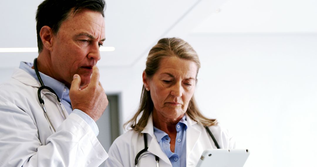 Doctors Using Tablet for Medical Consultation - Free Images, Stock Photos and Pictures on Pikwizard.com