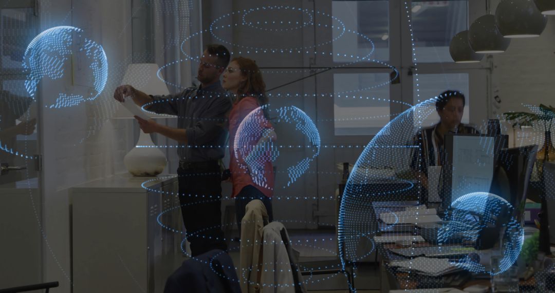Colleagues Collaborating in Futuristic Tech Office with Holographic Globes
