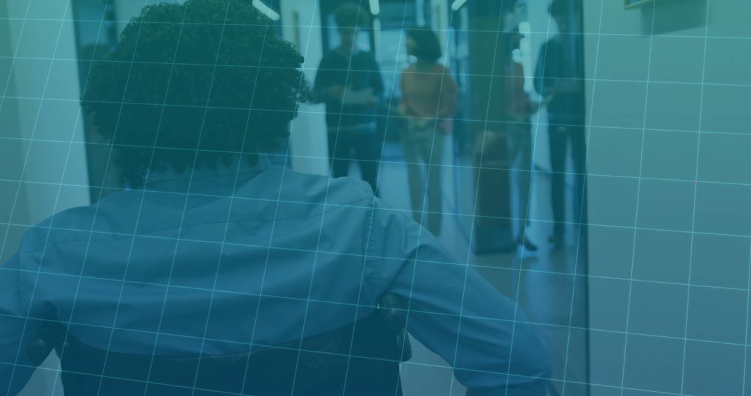 Wheelchair User Navigating Office Hallway for Accessibility and Inclusion