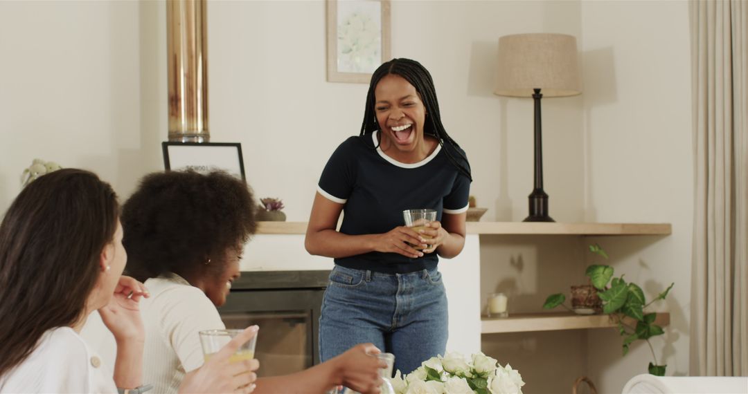 Women Enjoying Drinks and Laughter at Home