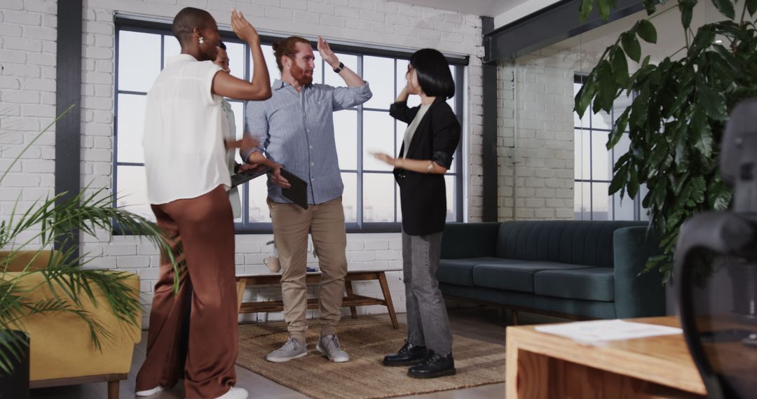 Team Celebrating Success in Contemporary Office