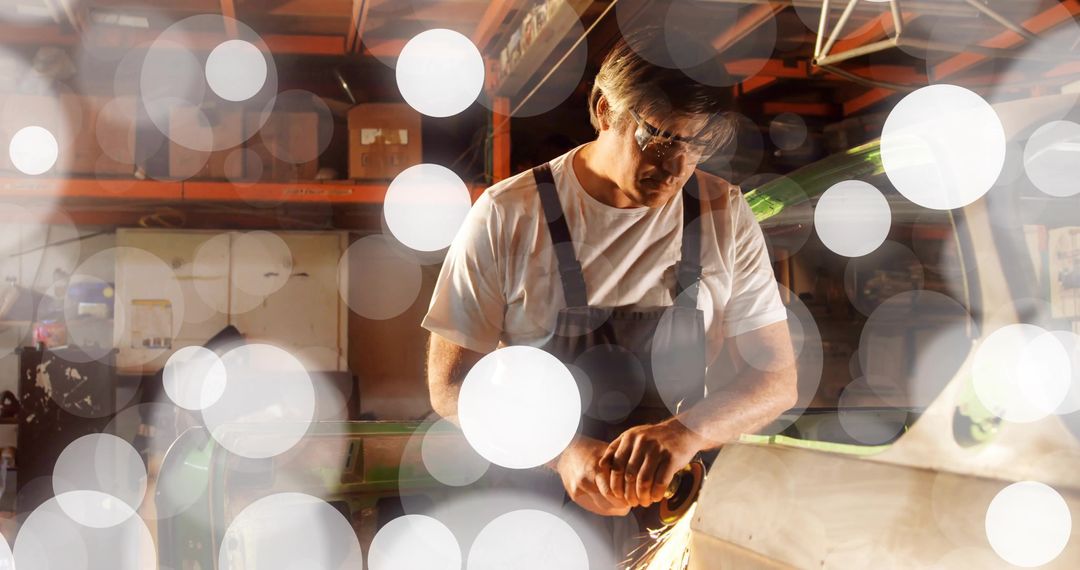 Craftsman Grinding Metal with Sparks Flying in Workshop