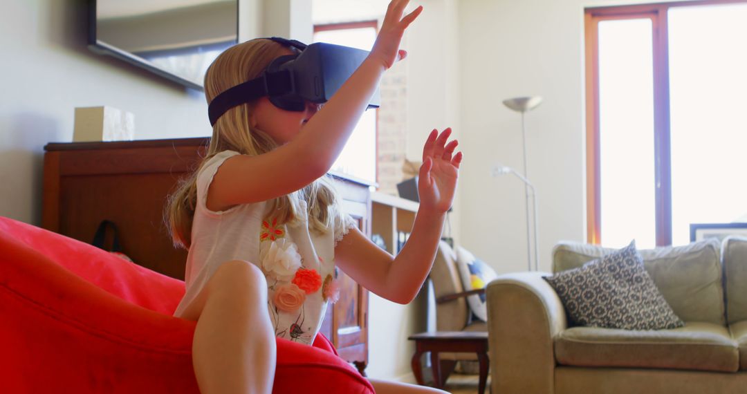 Child Experiencing Virtual Reality with VR Headset at Home - Free Images, Stock Photos and Pictures on Pikwizard.com