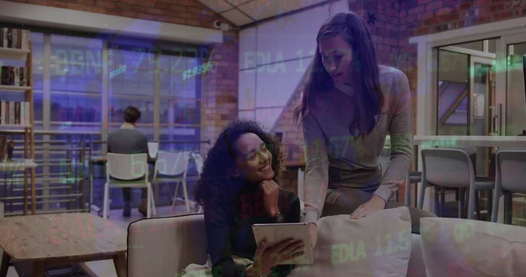Colleagues Collaborating with Stock Market Projections in Modern Office
