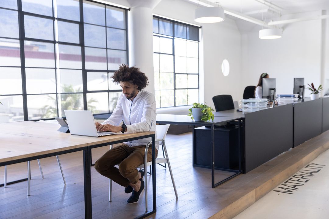 Modern Office Team Collaboration with Technology and Open Spaces