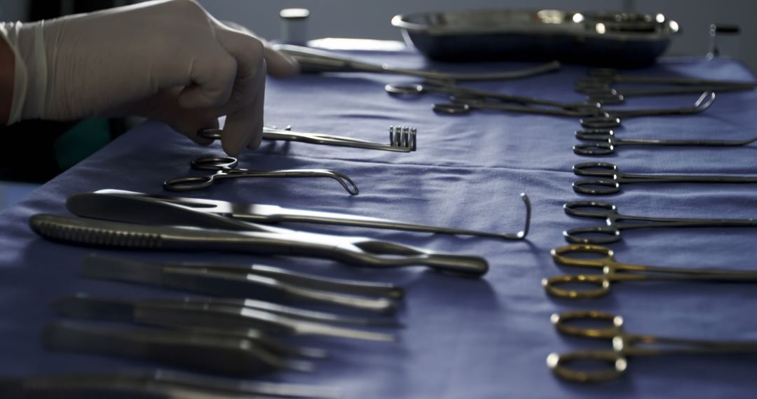 Close-up of surgeon arranging surgical tools on tray in operation room at the hospital - Free Images, Stock Photos and Pictures on Pikwizard.com