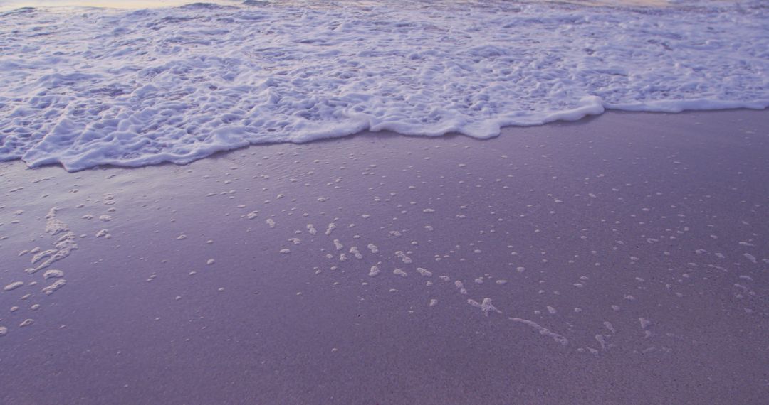 Serene Waves Gently Lapping Seashore at Sunset - Free Images, Stock Photos and Pictures on Pikwizard.com