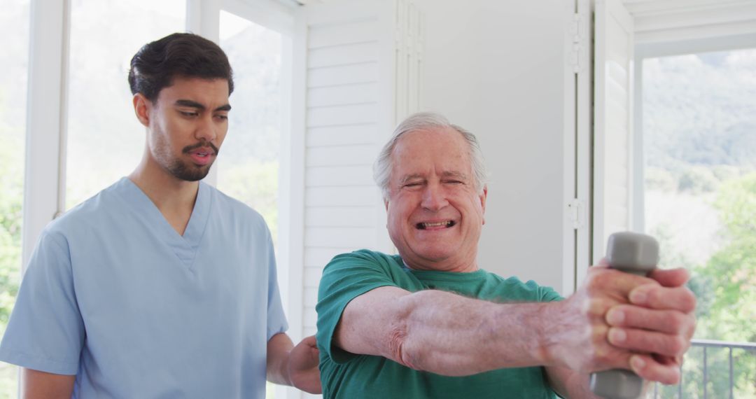 Senior Man Doing Physical Therapy with Young Male Therapist at Home - Free Images, Stock Photos and Pictures on Pikwizard.com