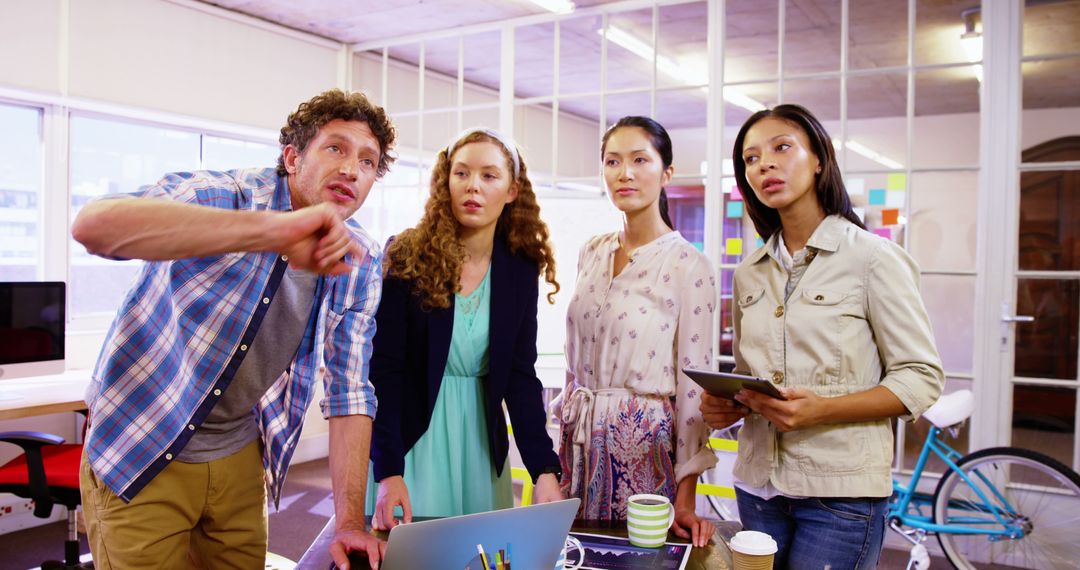 Diverse Professionals Engaged in Collaborative Office Discussion