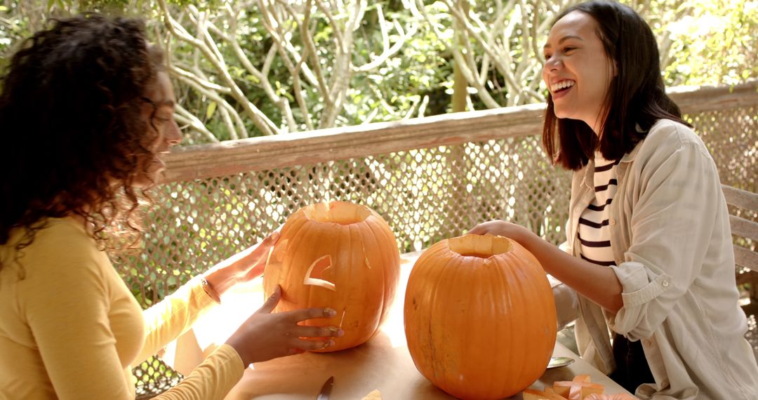 Multiracial Friends Carving Pumpkins for Halloween on Porch Free