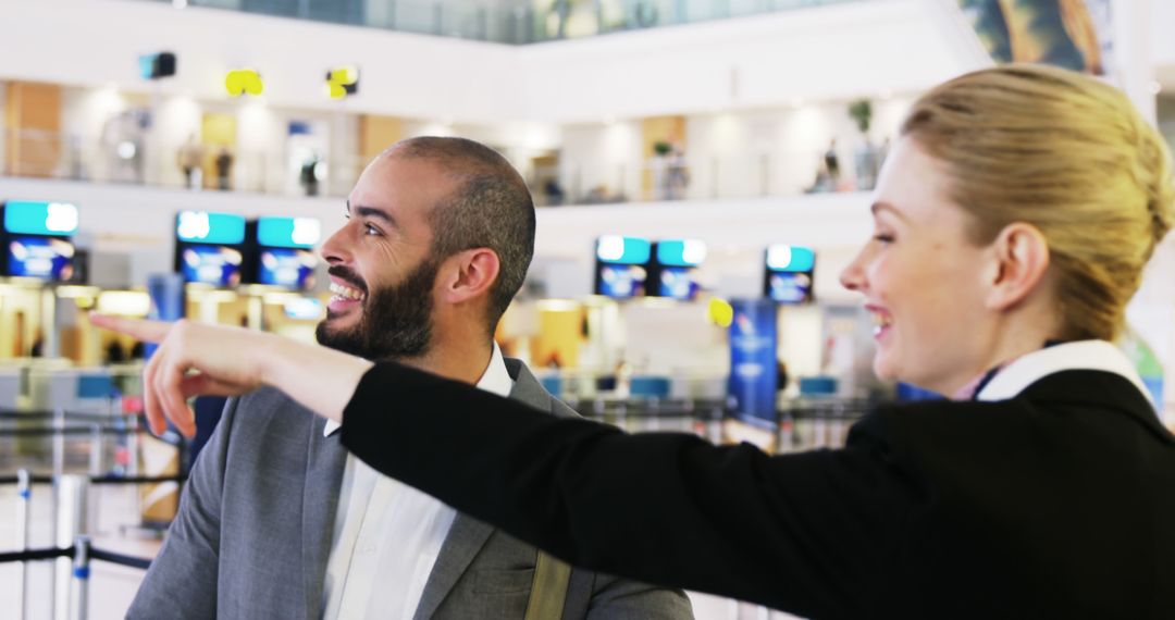Smiling Traveler and Airport Employee Enjoying Dialogue
