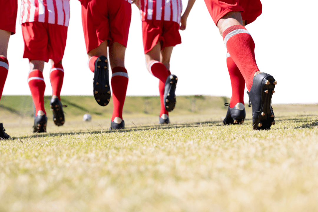 Diverse Male Football Players Running on Grass Transparent Background