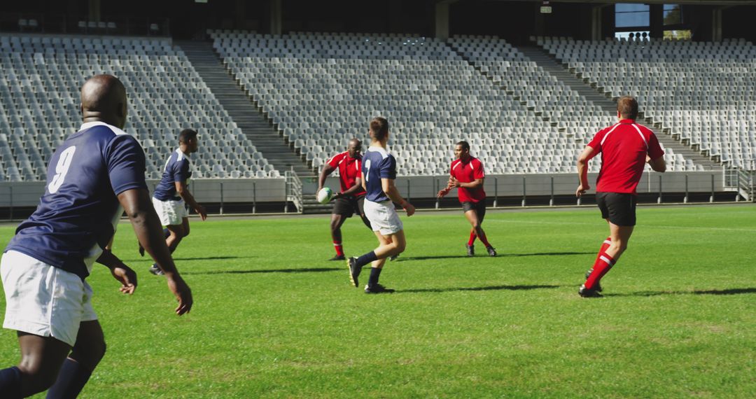 Amateur Rugby Game in Empty Stadium on Green Field - Free Images, Stock Photos and Pictures on Pikwizard.com