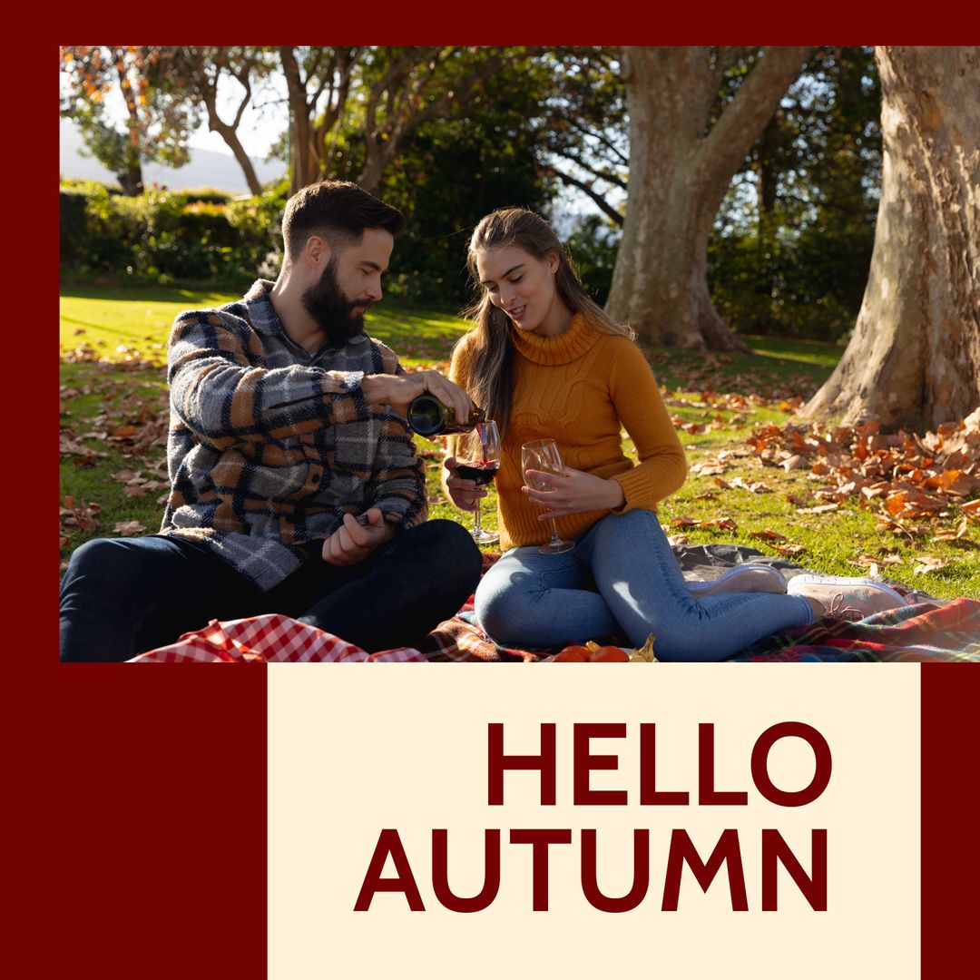 Couple Enjoying Wine Picnic Under Autumn Trees