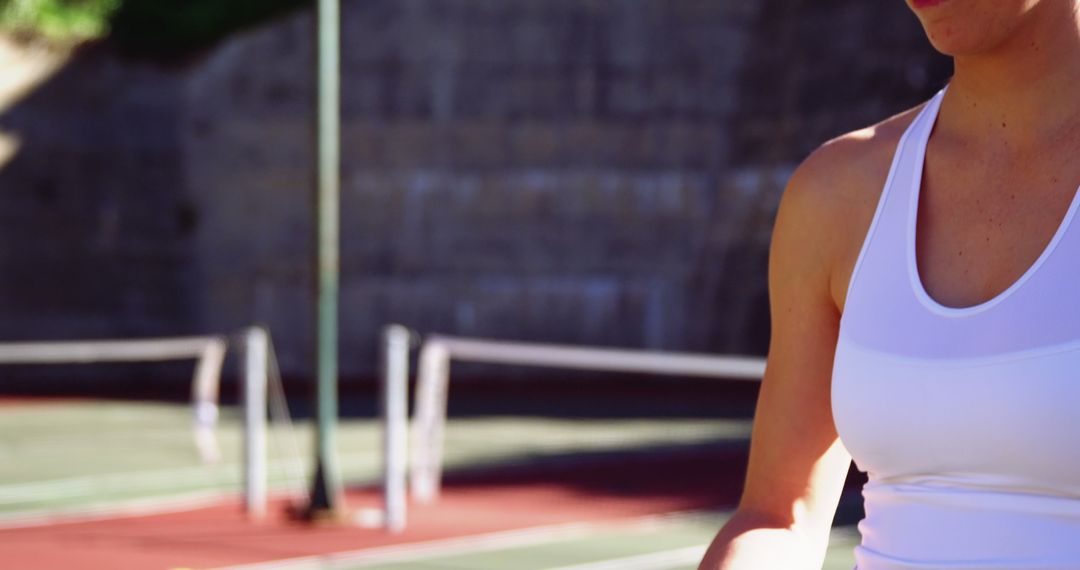 Woman Preparing for Tennis Match Outdoors - Free Images, Stock Photos and Pictures on Pikwizard.com