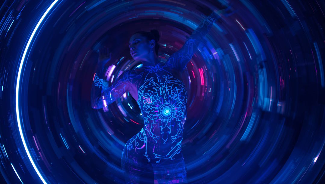 Futuristic Performer in Neon Tunnel with Glowing Circuit Bodysuit
