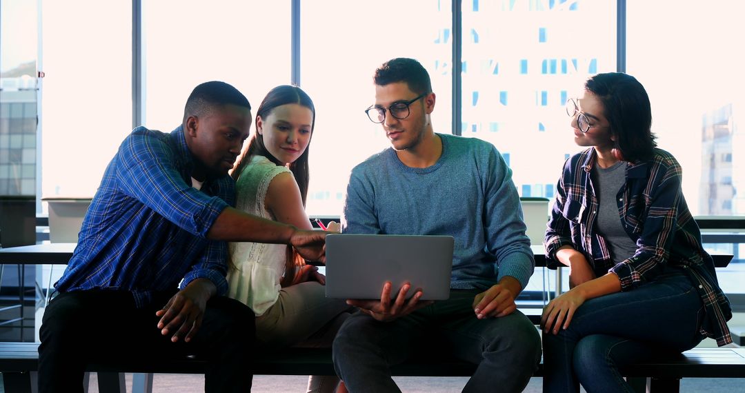 Young Diverse Professionals Collaborating in Modern Office Atmosphere