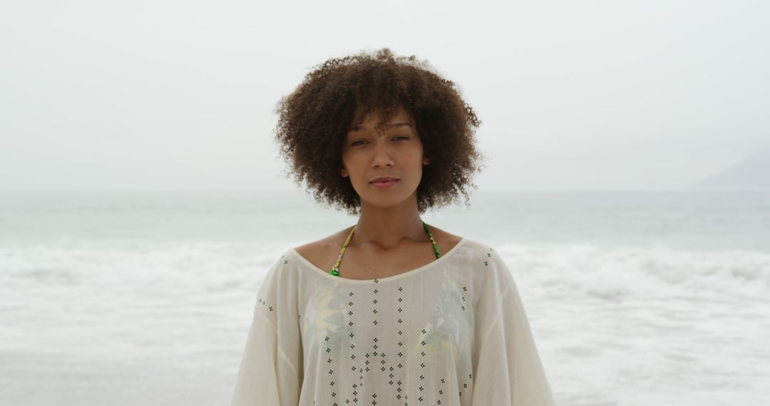 Portrait of Calm Woman Standing on Beach - Free Images, Stock Photos and Pictures on Pikwizard.com