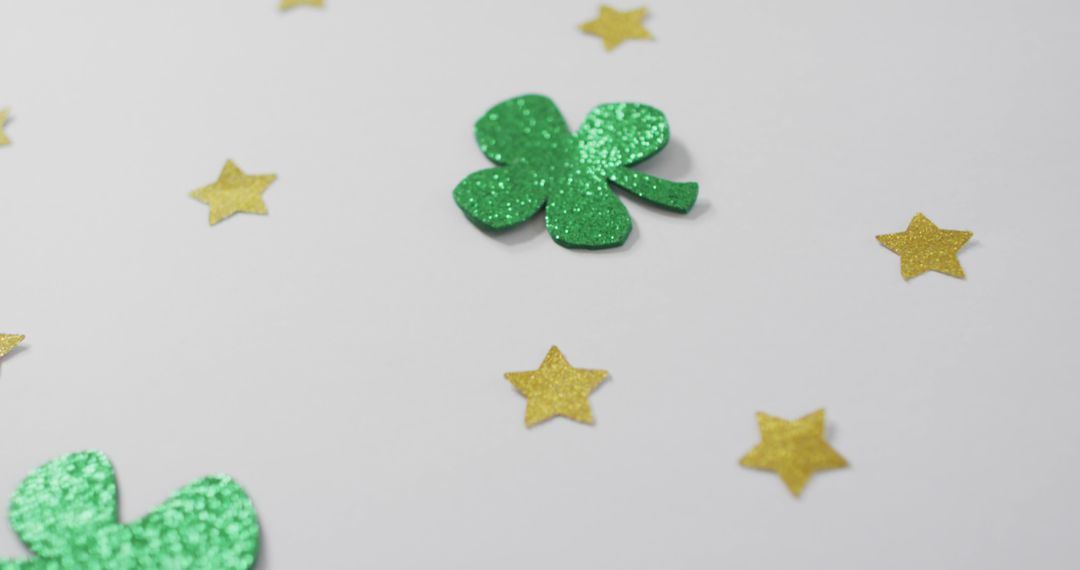 Glittery Shamrocks and Golden Stars Decorated on White Background - Free Images, Stock Photos and Pictures on Pikwizard.com