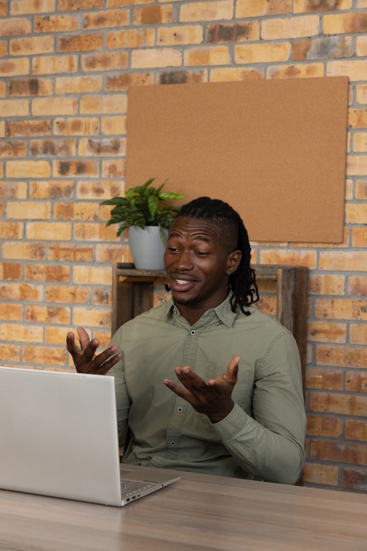 Professional Man Engaging in Video Call Home Office